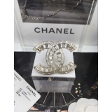 Золотая брошка Chanel камни
