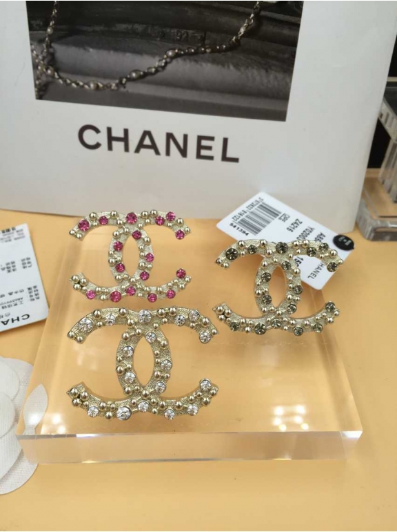 Золотая брошка Chanel розовые камни