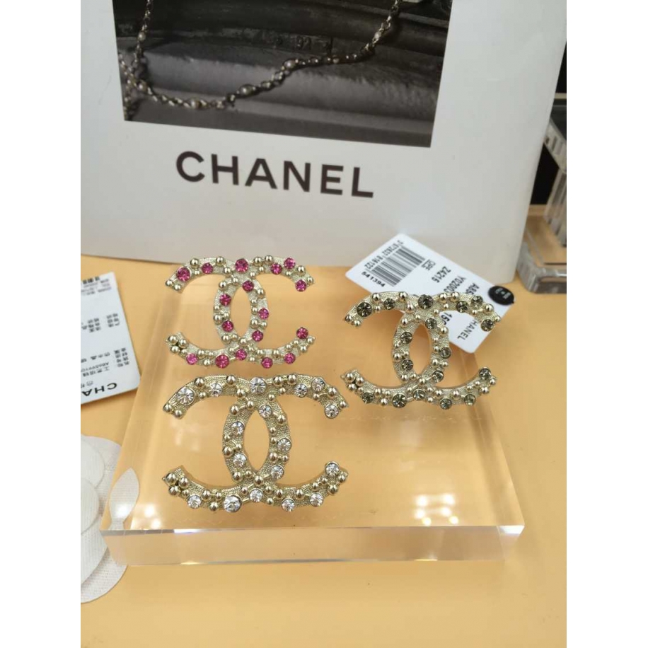 Золотая брошка Chanel розовые камни