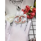 Золотая брошка Chanel красные камни