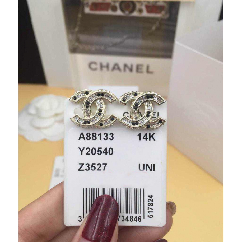 Золотые серьги Chanel камни